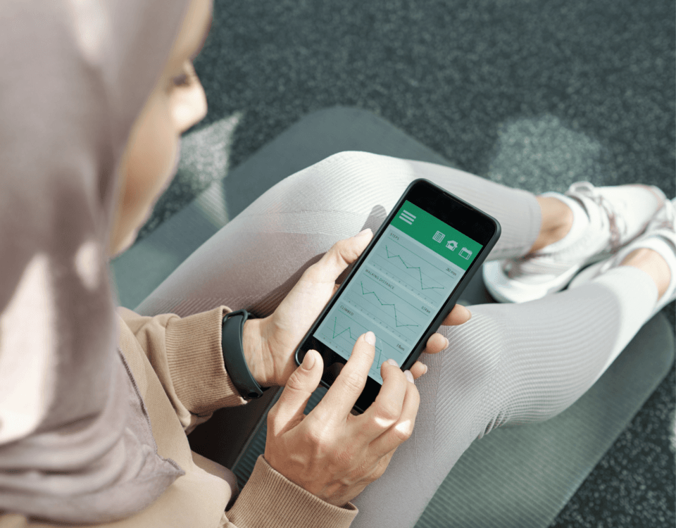 women checking fitness progress on phone