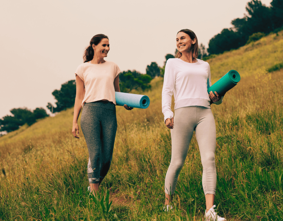 Women walking briskly outdoors for mental health and longevity