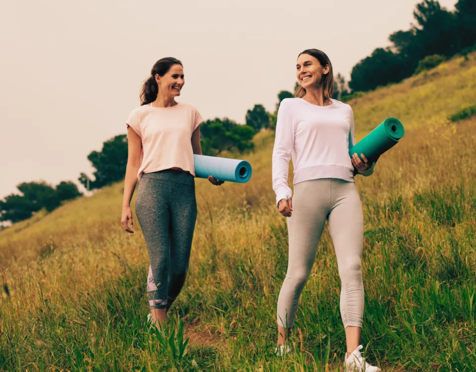 Women walking briskly outdoors for mental health and longevity
